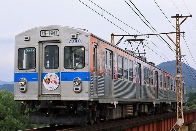 【弘南】桜ミクラッピング電車を不明で撮影した写真