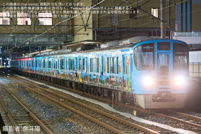 【JR西】323系LS15編成(スーパーマリオラッピング)奈良支所へ転削回送を柏原駅で撮影した写真