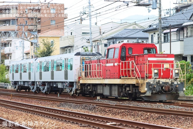 【横市交】10000形10011Fの中間車甲種輸送を不明で撮影した写真