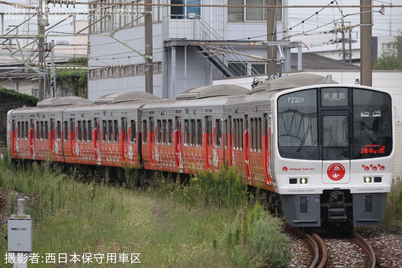 【JR九】811系PM2009編成が側面にカメラが設置し小倉総合車両センター出場の拡大写真